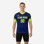 Custom navy soccer training jersey with neon yellow gradient sleeves and V-neck, front view on male model