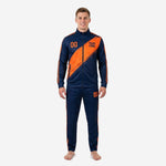Custom navy blue and orange soccer tracksuit front detail view showing stand collar full-zip jacket and contrast orange stripe construction