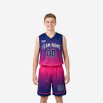 Custom navy and pink boys basketball uniforms with gradient sublimation, arced team name, and front number on youth player - front and back view