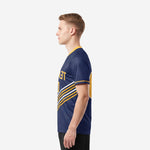 Custom navy soccer team shirts with Athletic Gold chevron stripe detail visible from right side profile on male model