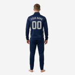 Navy soccer tracksuit jacket close-up showing sublimated chest crest placement and player number print zone