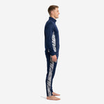 Custom navy soccer tracksuit left side view showing marble silver panel running from shoulder to ankle cuff
