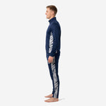Custom navy soccer tracksuit right side view showing tapered pants and matching marble silver leg panel