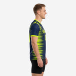 Custom navy soccer training jersey showing neon yellow sublimated streak pattern and contrast sleeve cuff, left side view