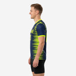 Custom navy soccer training jersey with full-dye sublimation in navy and neon yellow, right side view on male model
