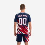 Custom navy soccer uniform set front detail showing team name, front number, and crimson V-neck collar trim