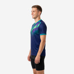 Custom navy teal soccer training top with aurora light ray print across chest and teal sleeve cuffs, right side view on male model