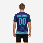 Back view of custom navy soccer training jersey with teal player name and number print, botanical sleeve pattern