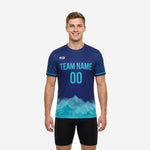 Custom navy soccer training jersey with cyan gradient hem and botanical sleeve print, front view on adult male model