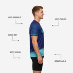 Sleeve detail of custom navy soccer training jersey showing tonal botanical leaf sublimation print and cyan cuff stripe