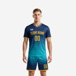 Custom navy blue to teal gradient soccer uniform men front view with gold trim and team name print