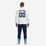 Close detail of stand collar and full-zip placket on white and navy custom soccer tracksuit jacket with sublimated powder blue panels