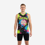 Custom neon basketball jersey in black with lime green pink and blue paint-splash sublimation print, team name and number 00 on front, men's athletic cut