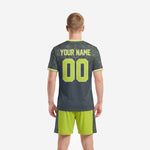 Custom neon green soccer jersey crew neck detail with white trim and geometric web pattern on charcoal