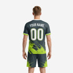 Custom charcoal and neon green soccer jersey detail showing sublimated diagonal stripe texture and crew neck trim