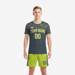 Custom neon green soccer uniforms in charcoal geometric print, front view, mens full kit with team name and number