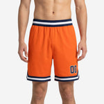 Custom orange basketball shorts with navy and white striped waistband and chevron hem stripe, player number 00 on lower left thigh, front view