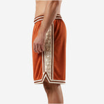 Left side view of custom orange basketball shorts with cream side panel and elastic striped waistband