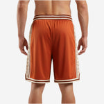 Right side view of custom orange basketball shorts showing burnt-orange mesh body and cream panel detail