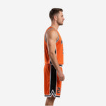 Front view of the custom orange basketball uniform with arched team name and number 15 on the jersey and matching shorts