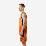 Opposite side view of orange basketball uniform with navy armhole binding and gradient amber to orange crack pattern