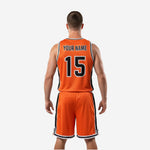 Opposite side view of the custom orange basketball uniform showing black panel continuity on both jersey and shorts