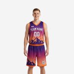 Custom orange basketball uniform two-piece set with purple-to-orange gradient and pixel mountain graphic, front view on male model