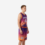 Side view of custom orange basketball uniform showing gradient fade from purple chest to orange hem with orange V-neck and armhole binding