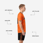 Custom black soccer shorts with orange grid side panel and orange player number on left thigh