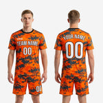 Complete custom orange and charcoal digital camo soccer uniform set jersey and matching shorts full kit view
