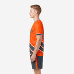 Custom orange and charcoal soccer kit right side view showing crew neck collar trim and athletic cut jersey