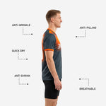 Close detail of orange contrast cuff band on custom graphite and orange soccer training jersey short sleeve