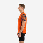 Two tone training jersey in orange and navy camo side profile showing athletic cut and crew neck binding