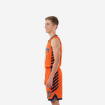 Opposite side view of orange youth basketball uniform set with navy diagonal stripes on jersey and shorts side panels