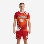 Custom orange soccer uniform with red spike pattern, V-neck jersey and matching shorts, front view on male model