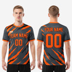 Custom orange soccer jersey sleeve cuff detail showing Athletic Orange rib trim matching the crew-neck collar