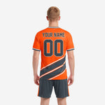 Detail view of diagonal charcoal stripe panel with white separating lines on custom orange soccer uniform jersey