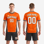 Full orange and black soccer outfit set by K2 Sportswear, custom team soccer uniform kit