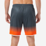 Close-up of orange soccer shorts player number 00 sublimated in Athletic Orange with white outline on right leg