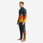 Custom sublimated orange soccer tracksuit side view showing gold constellation side panel on charcoal pants