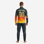 Close-up of orange soccer tracksuit jacket front with team logo placement, chest number, and stand collar