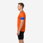 Orange soccer training jersey with Royal Blue gradient sleeves and V-neck contrast collar, second side profile angle