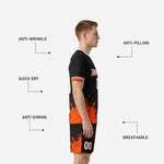 Detail of black soccer shorts with Athletic Orange splash graphic and player number on right leg