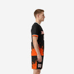 Side view of custom orange soccer uniform and matching shorts with mirrored Athletic Orange splash print