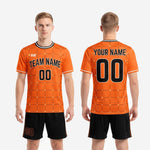 Custom orange and black soccer uniform full kit back view showing player name and number placement on adult male model
