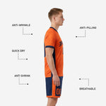 Navy blue soccer shorts with orange side panels and hem band, part of custom orange soccer uniform set