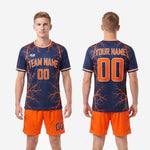 Custom orange soccer uniform full squad navy kit back view showing player name and number placement on sublimated jersey