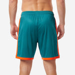 Back view of custom orange and teal soccer shorts with sublimated print and orange contrast trim
