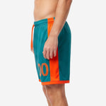 Side detail of custom orange soccer shorts with orange hem band trim and contrast side panel, mens match shorts