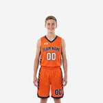 Custom orange youth basketball uniforms with diagonal navy stripe side panels, arced team name, and front number 00 on jersey and shorts - full set front view
